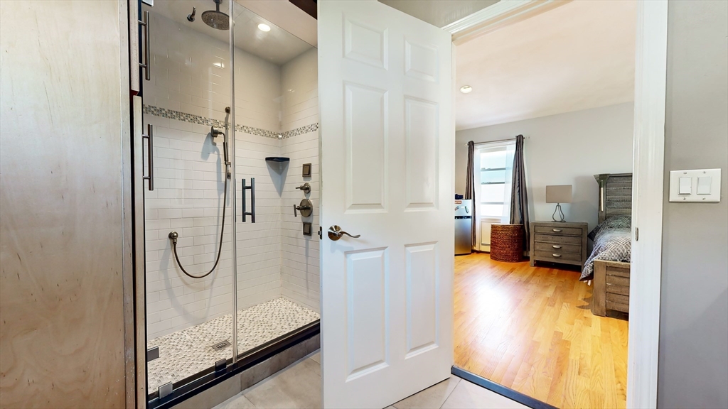 11 Atlantic Avenue Saugus, MA 01906 - Photo 10 of 22 a bathroom with a glass shower door