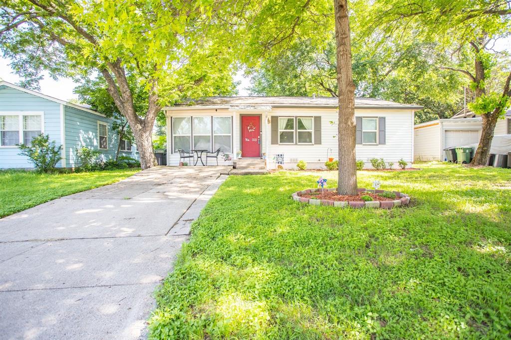 312 Elm Street Hurst, TX 76053 - Photo 1 of 1 a front view of house with yard and green space
