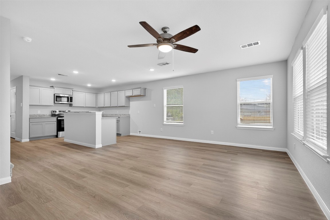 706 Universal Street Navasota, TX 77868 - Photo 13 of 40 a view of kitchen with refrigerator and window