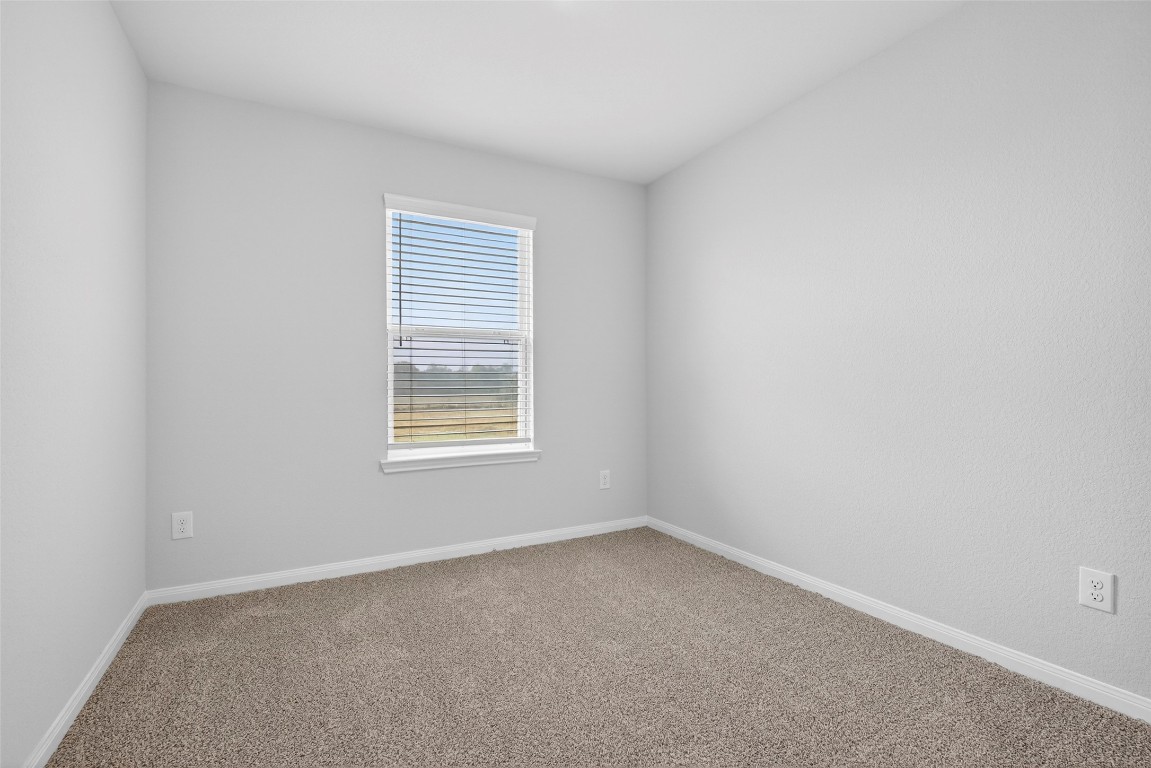 706 Universal Street Navasota, TX 77868 - Photo 21 of 40 an empty room with a window