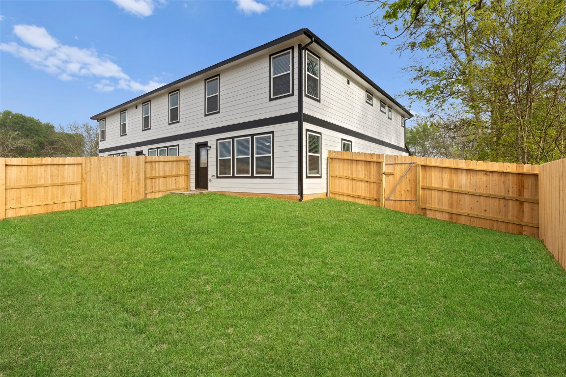 706 Universal Street Navasota, TX 77868 - Photo 26 of 40 a view of a house with a yard