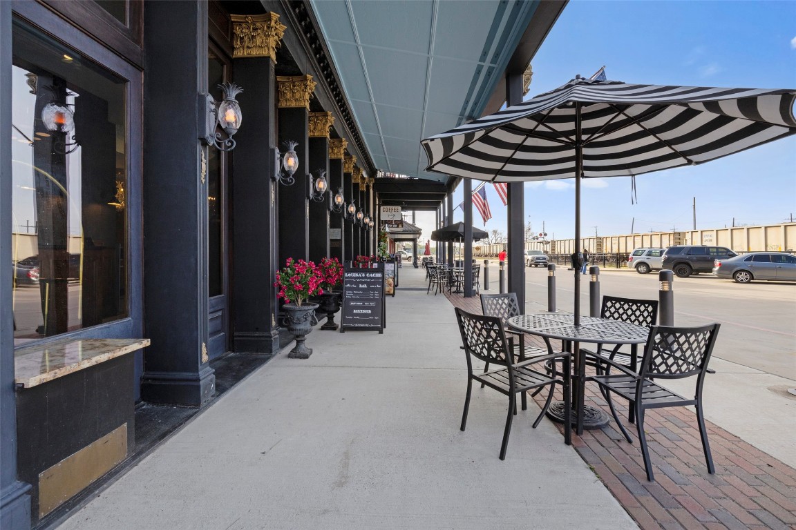 706 Universal Street Navasota, TX 77868 - Photo 34 of 40 a view of a chairs and table in patio with a barbeque