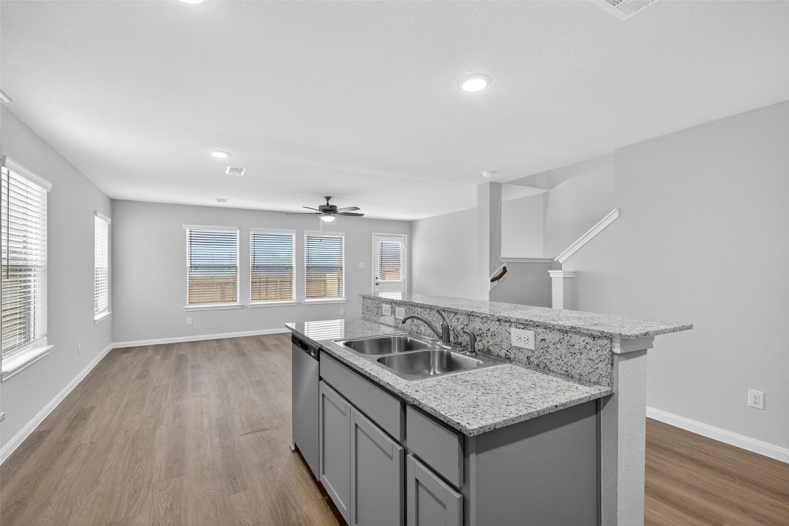 706 Universal Street Navasota, TX 77868 - Photo 9 of 40 a kitchen with a sink a counter space and wooden floor