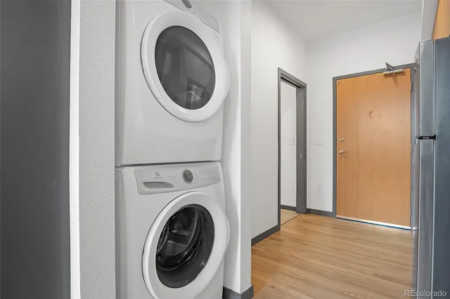 a view of a hallway with washer and dryer