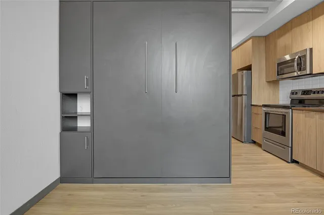 a view of a kitchen from the hallway