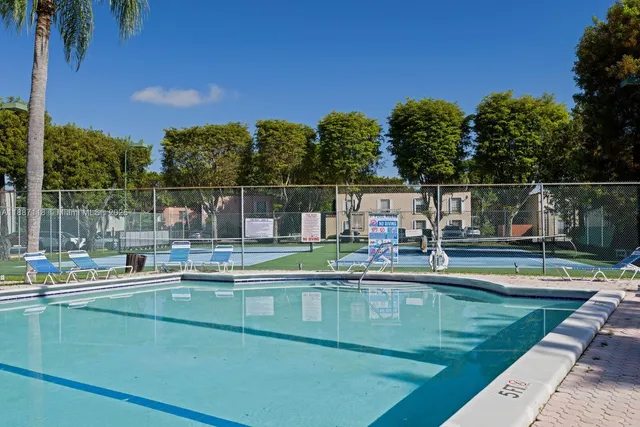 a view of a swimming pool with a patio