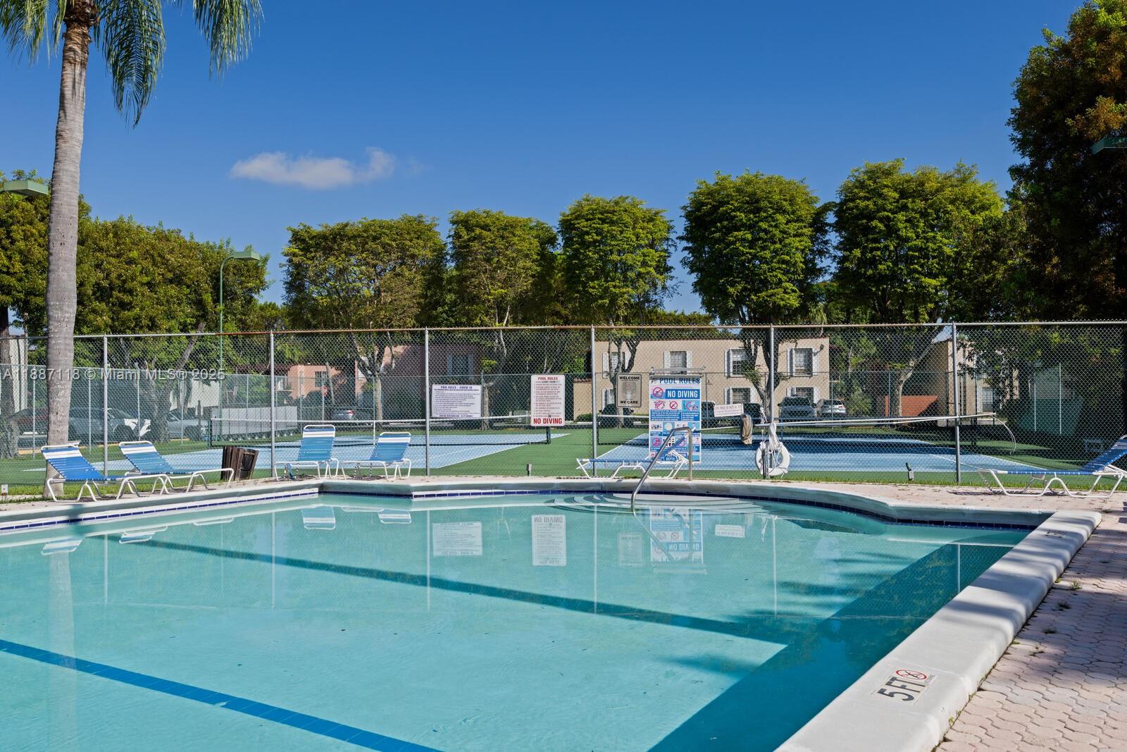 10816 North Kendall Drive, Unit R16 Miami, FL 33176 - Photo 12 of 12 a view of a swimming pool with a patio