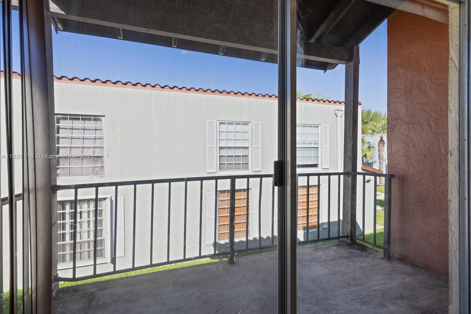 10816 North Kendall Drive, Unit R16 Miami, FL 33176 - Photo 6 of 12 a view of a balcony
