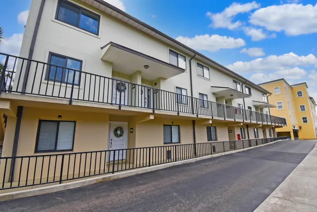 a view of a lake with outdoor seating