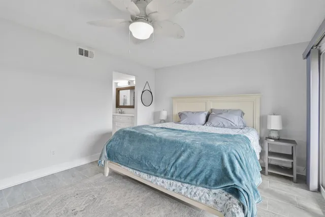 a bathroom with a double vanity sink mirror and shower