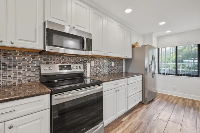 a view of storage and utility room with washer and dryer