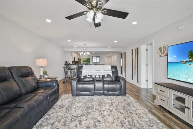 an empty room with wooden floor and closet