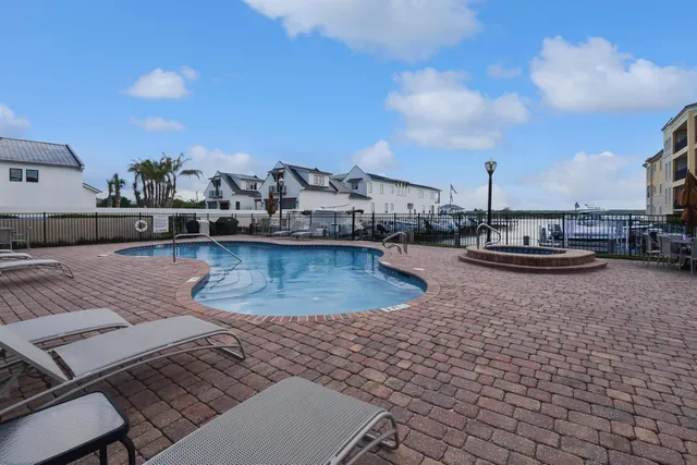 a view of a swimming pool with outdoor seating