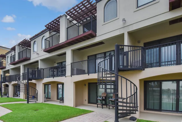 a building with potted plants in front of it