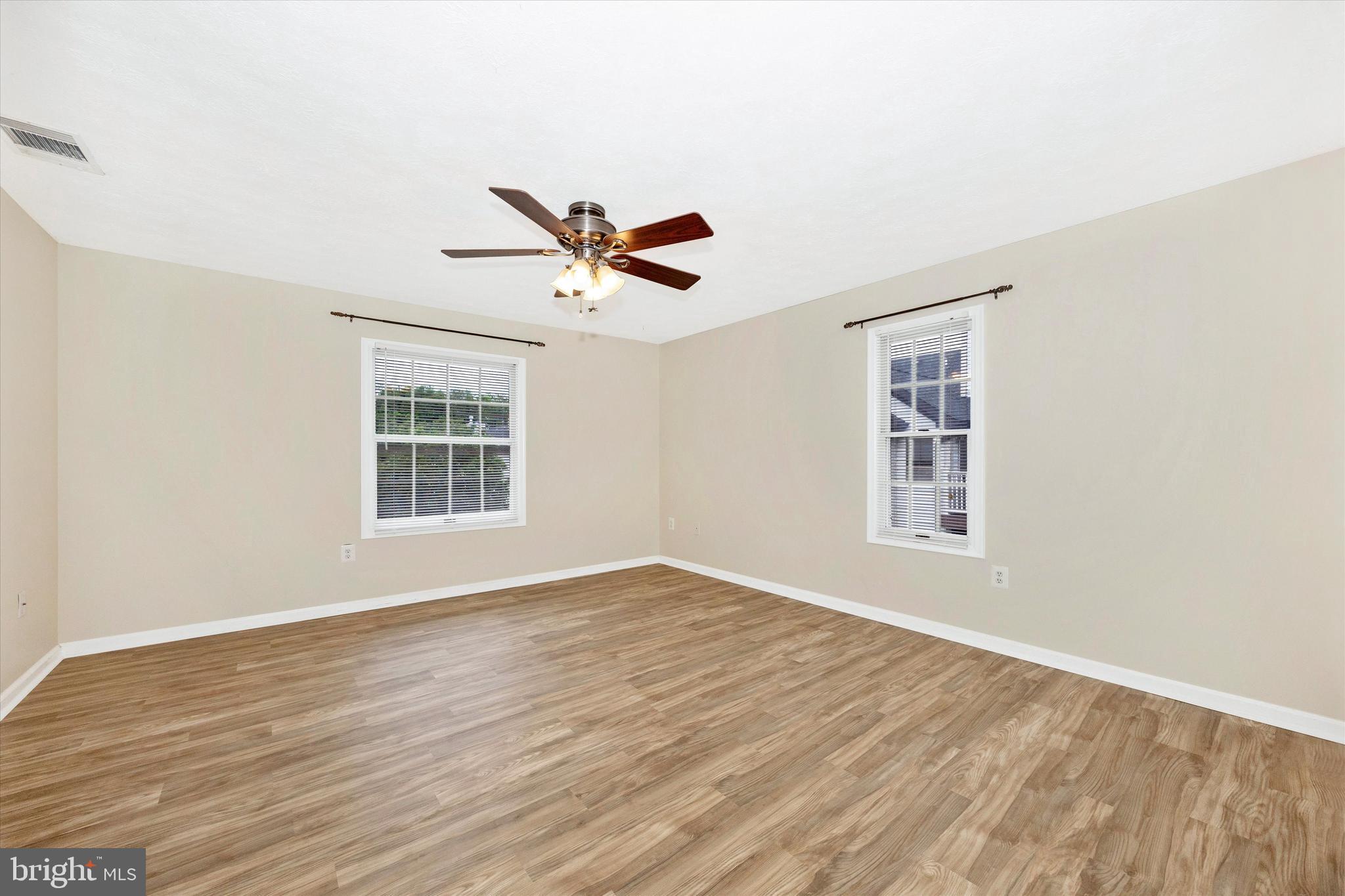 813 Stratford Way, Unit J Frederick, MD 21701 - Photo 14 of 25 Primary bedroom with two windows