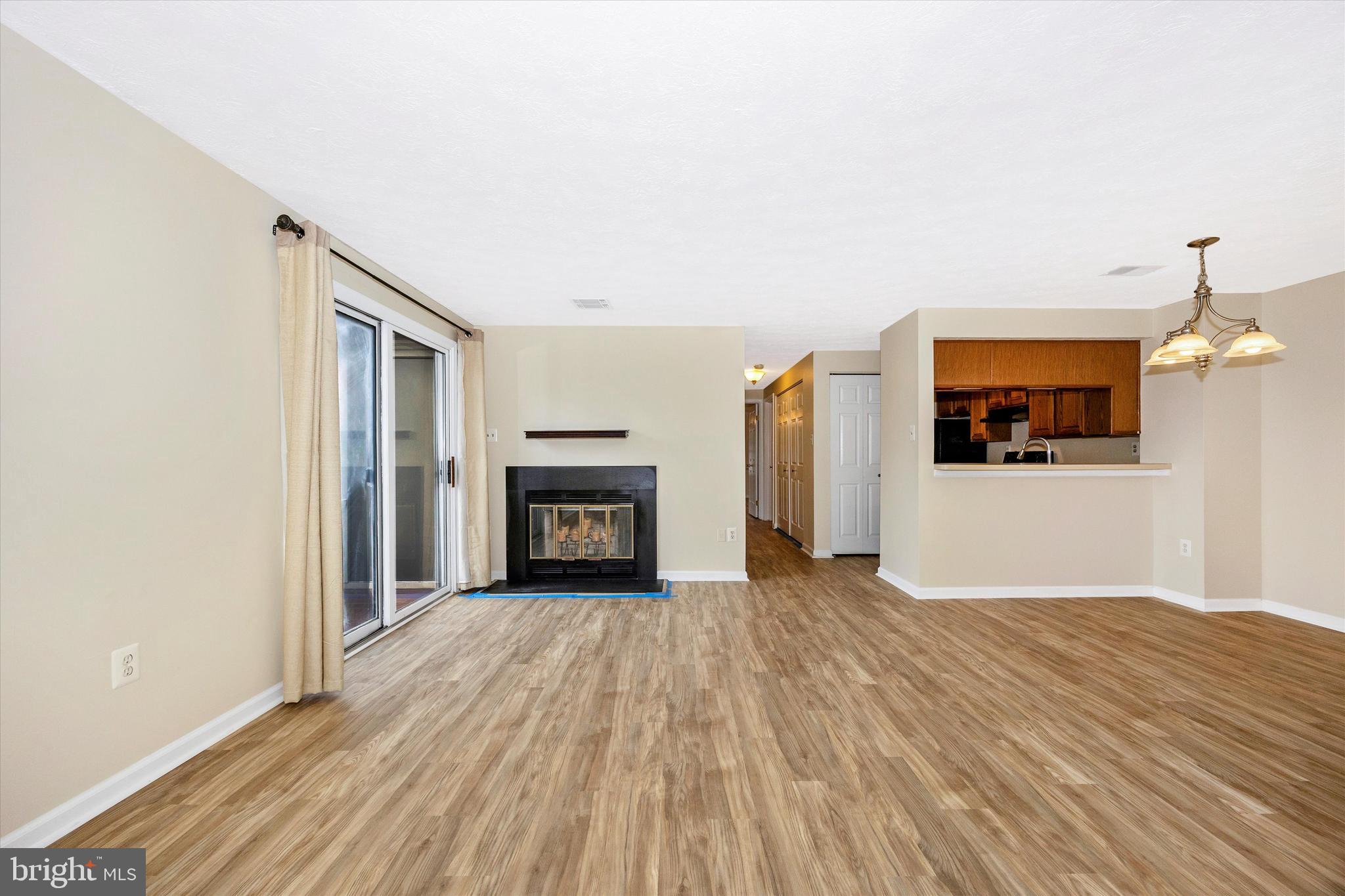 813 Stratford Way, Unit J Frederick, MD 21701 - Photo 6 of 25 Living room featuring fireplace