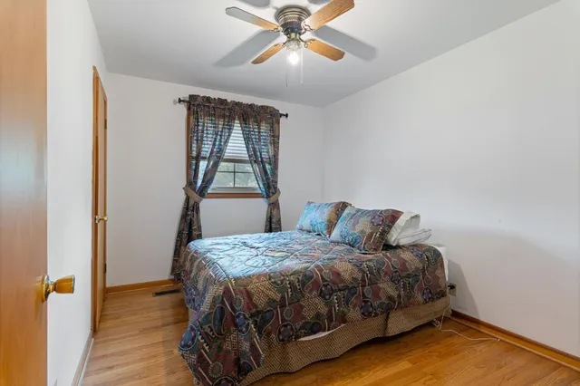 a bedroom with a bed and window