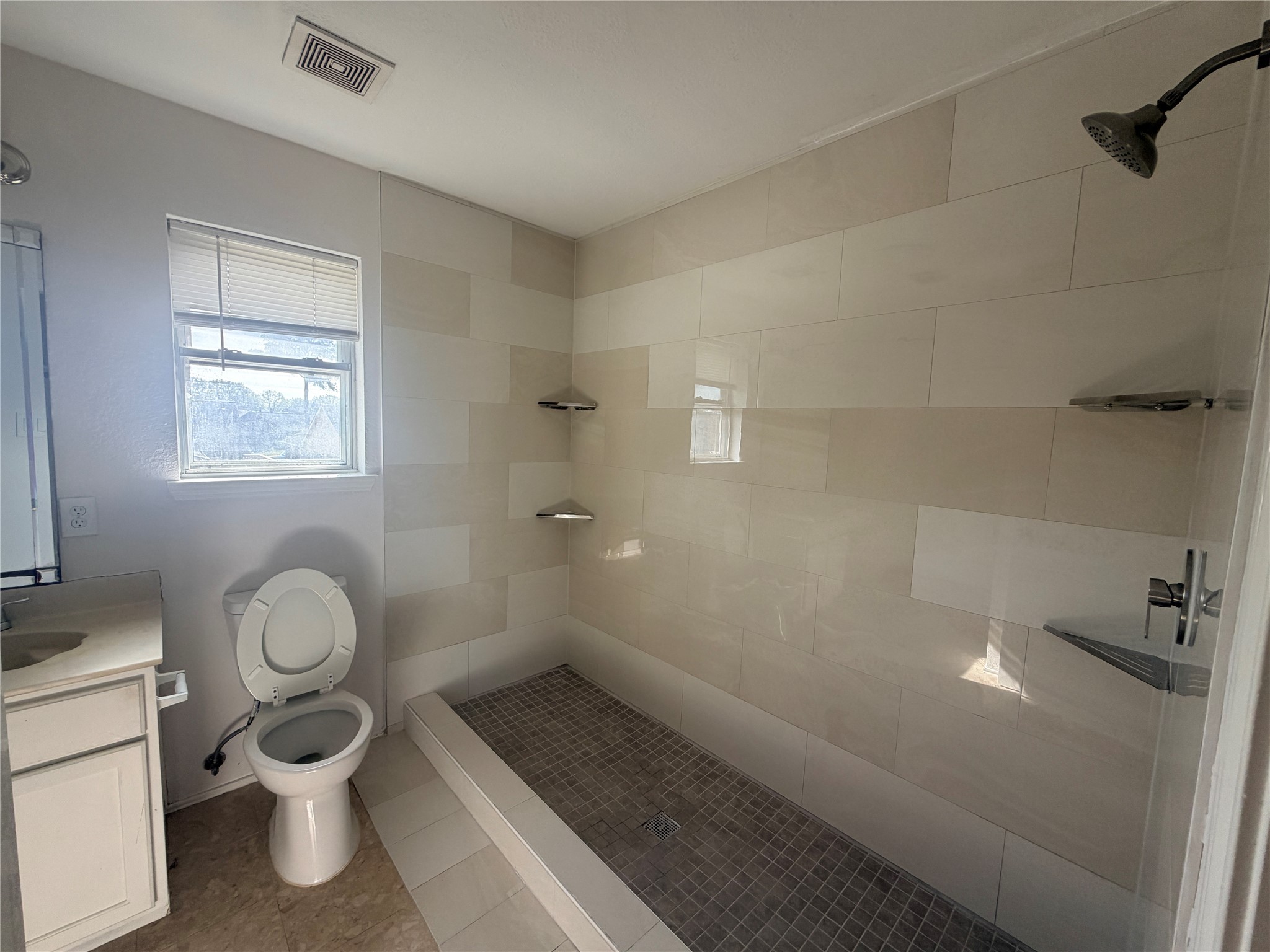 14014 Long Shadow Drive Houston, TX 77015 - Photo 11 of 16 a bathroom with a toilet sink and mirror