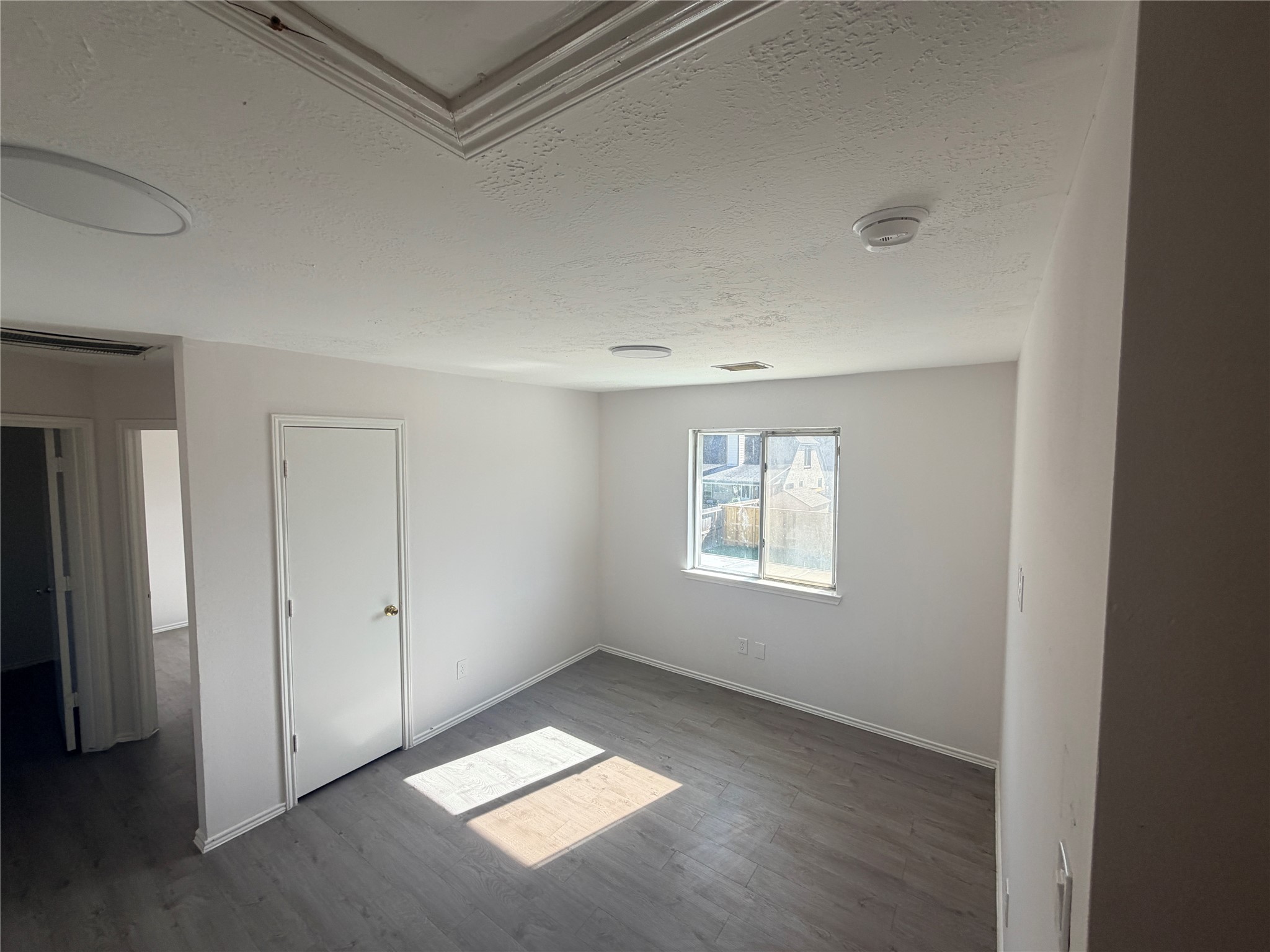 14014 Long Shadow Drive Houston, TX 77015 - Photo 9 of 16 an empty room with windows