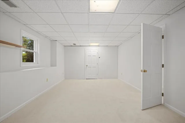 a view of a brick house with a large window