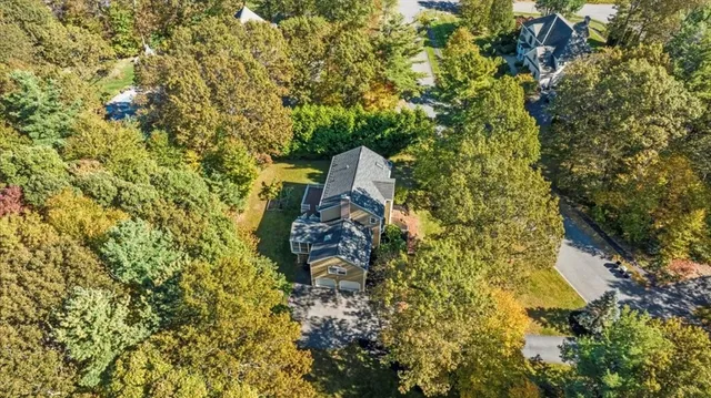 a view of a house with swimming pool and sitting area