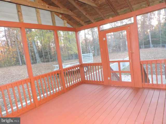 a view of porch with wooden floor
