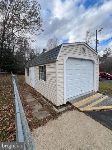 a view of a backyard of the house