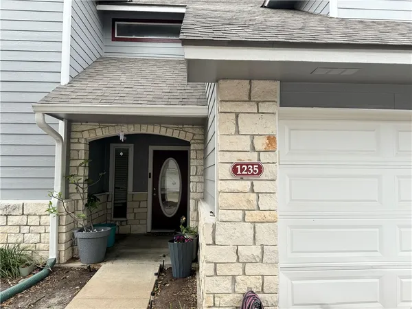 a front view of a house with a door