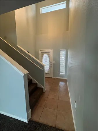 a view of entryway with stairs