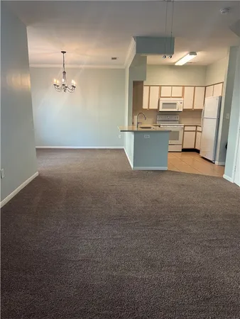 a view of a kitchen with a sink and dishwasher