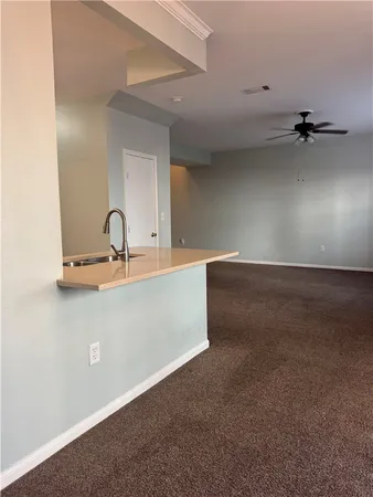 a view of a house with a door and wooden roof
