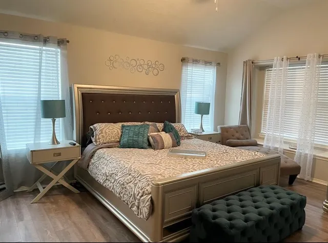 a bedroom with a bed and window