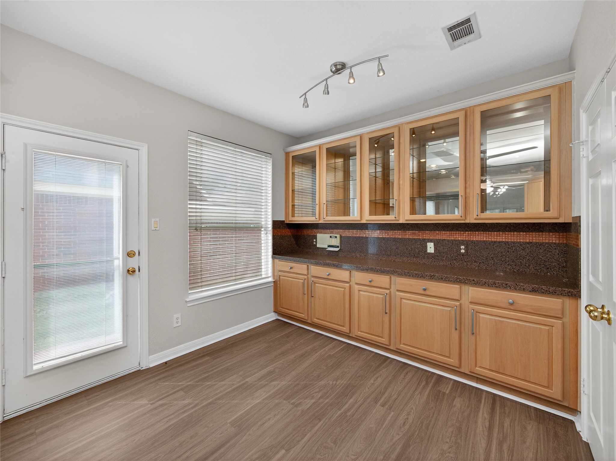 11029 Ballybunion Place Austin, TX 78747 - Photo 11 of 40 a large white kitchen with granite countertop a large window and a sink