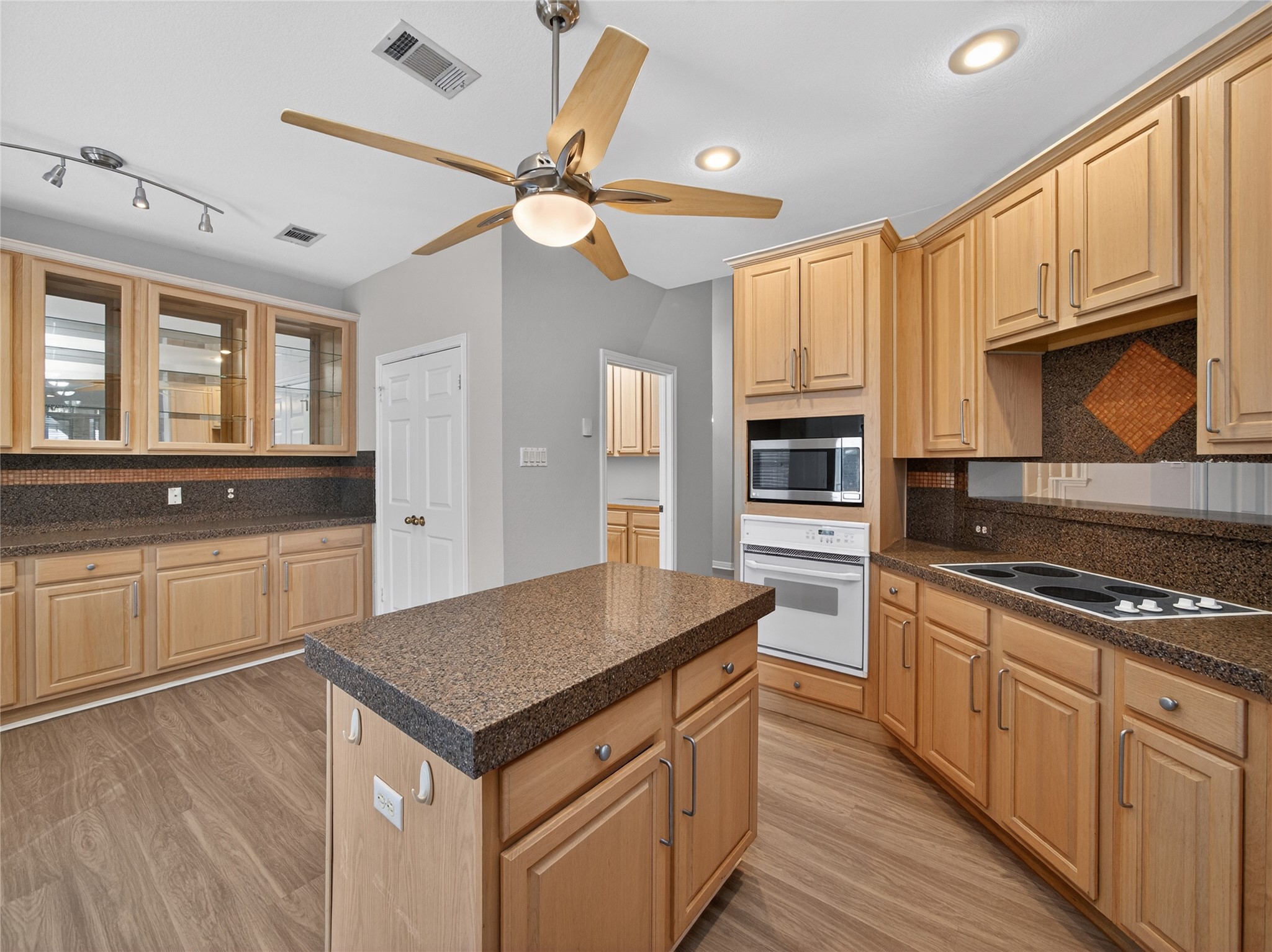 11029 Ballybunion Place Austin, TX 78747 - Photo 14 of 40 a kitchen with stainless steel appliances granite countertop a stove and a sink
