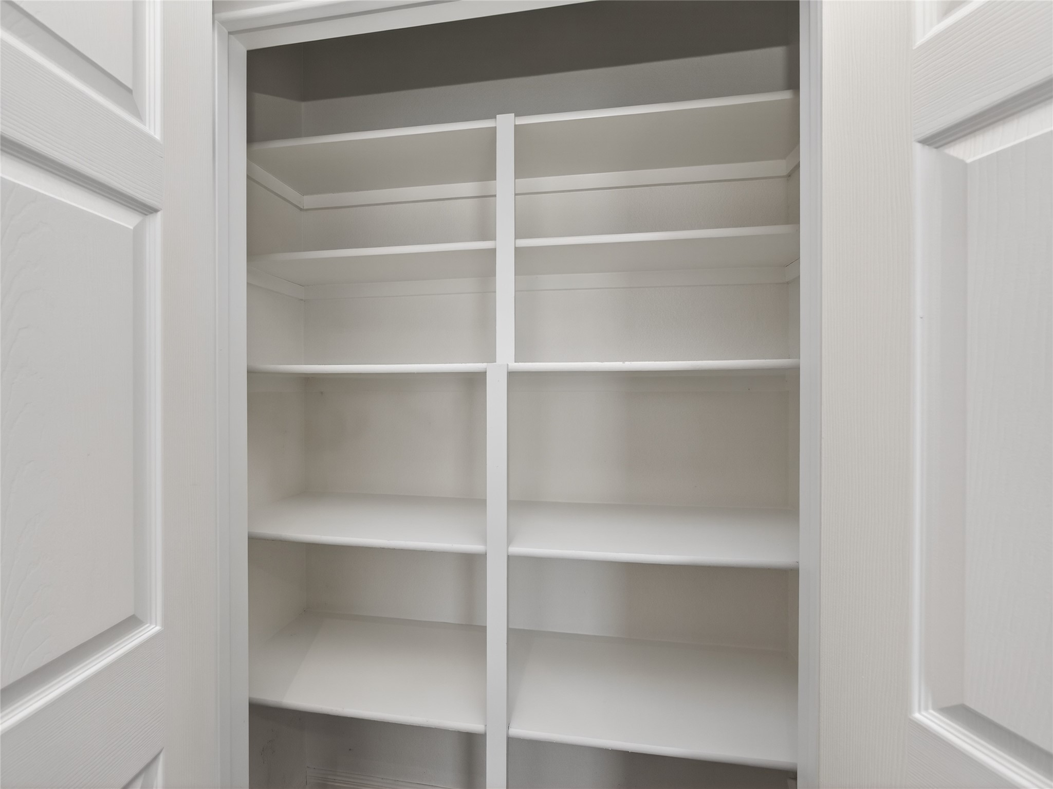 11029 Ballybunion Place Austin, TX 78747 - Photo 15 of 40 a view of walk in closet with empty racks
