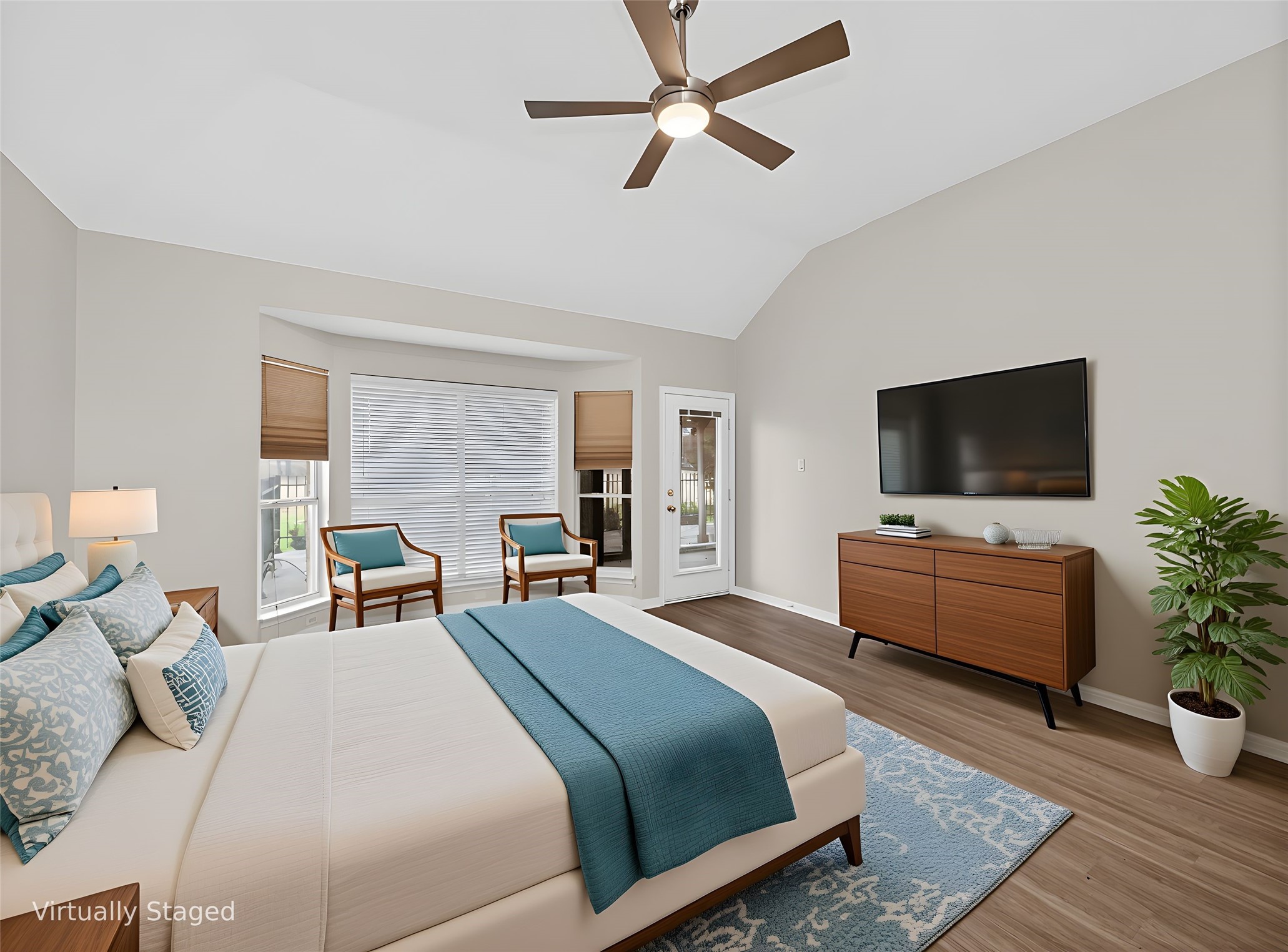 11029 Ballybunion Place Austin, TX 78747 - Photo 17 of 40 a bedroom with a bed and a flat screen tv