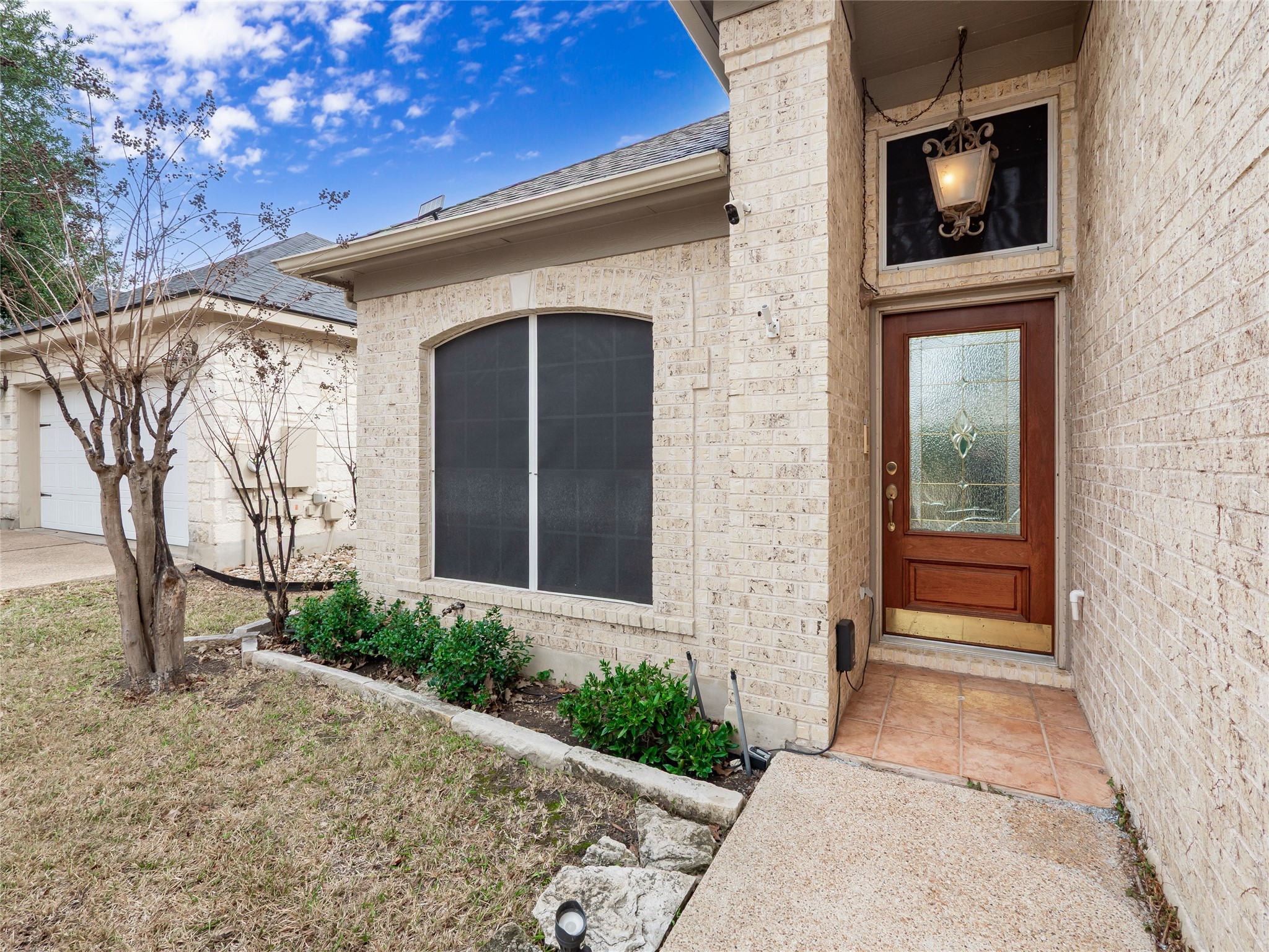11029 Ballybunion Place Austin, TX 78747 - Photo 2 of 40 a front view of a house with a yard and garage