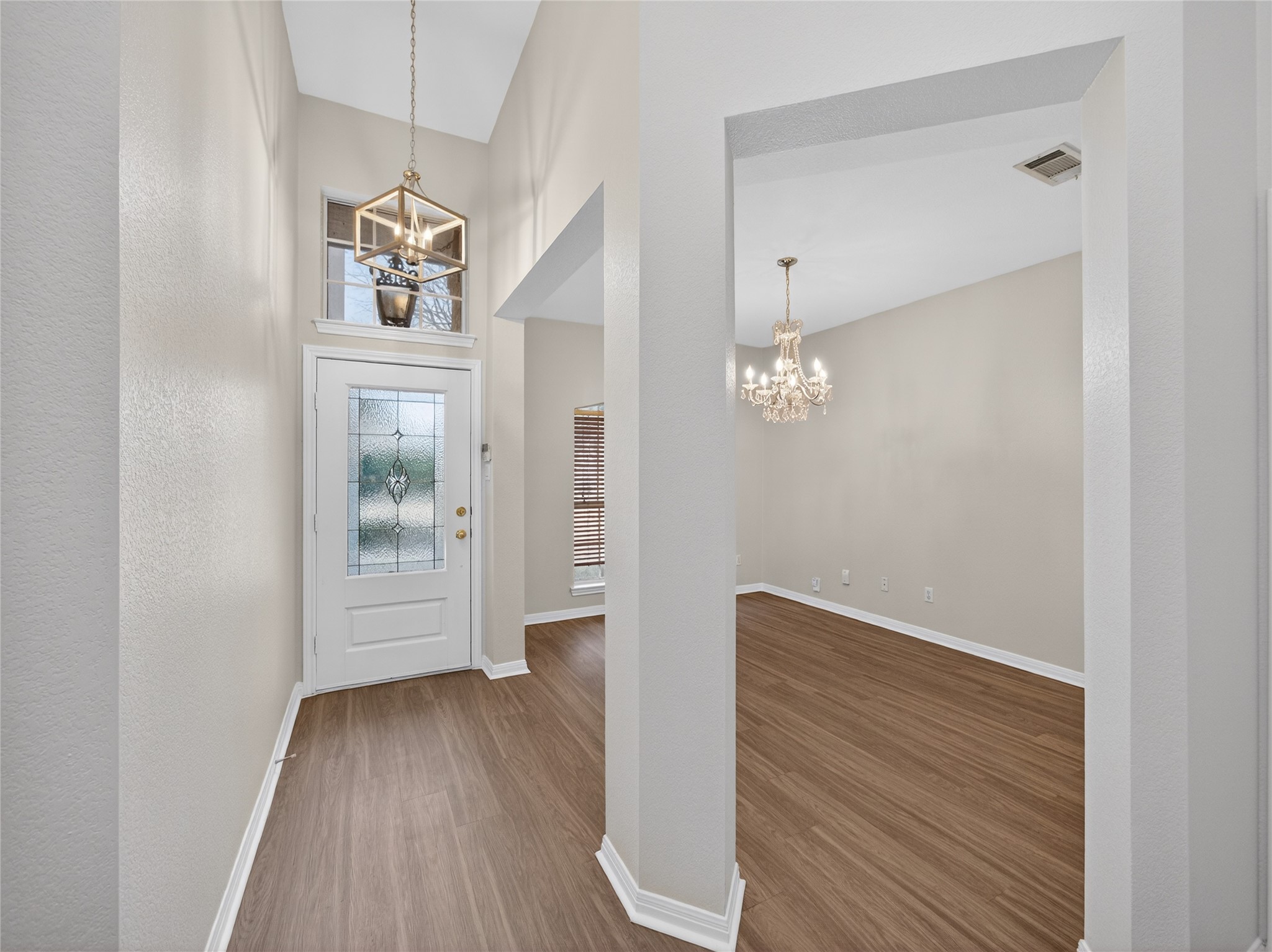 11029 Ballybunion Place Austin, TX 78747 - Photo 3 of 40 a view of livingroom with hardwood floor and kitchen view