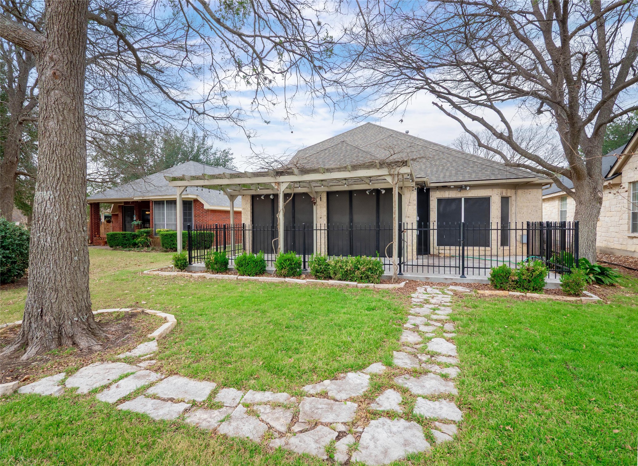 11029 Ballybunion Place Austin, TX 78747 - Photo 34 of 40 a front view of a house with garden
