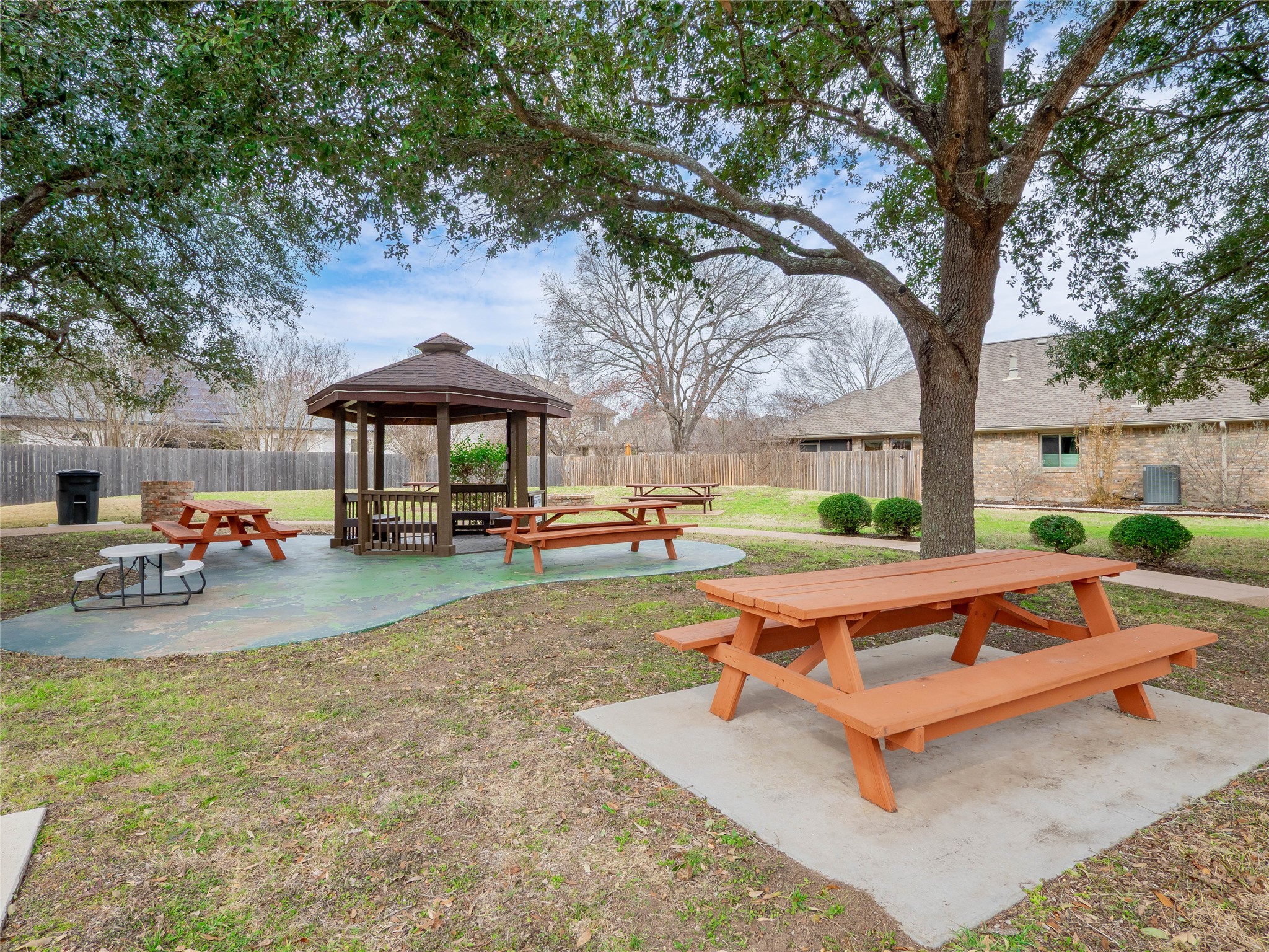 11029 Ballybunion Place Austin, TX 78747 - Photo 38 of 40 a view of a patio with table and chairs under an umbrella