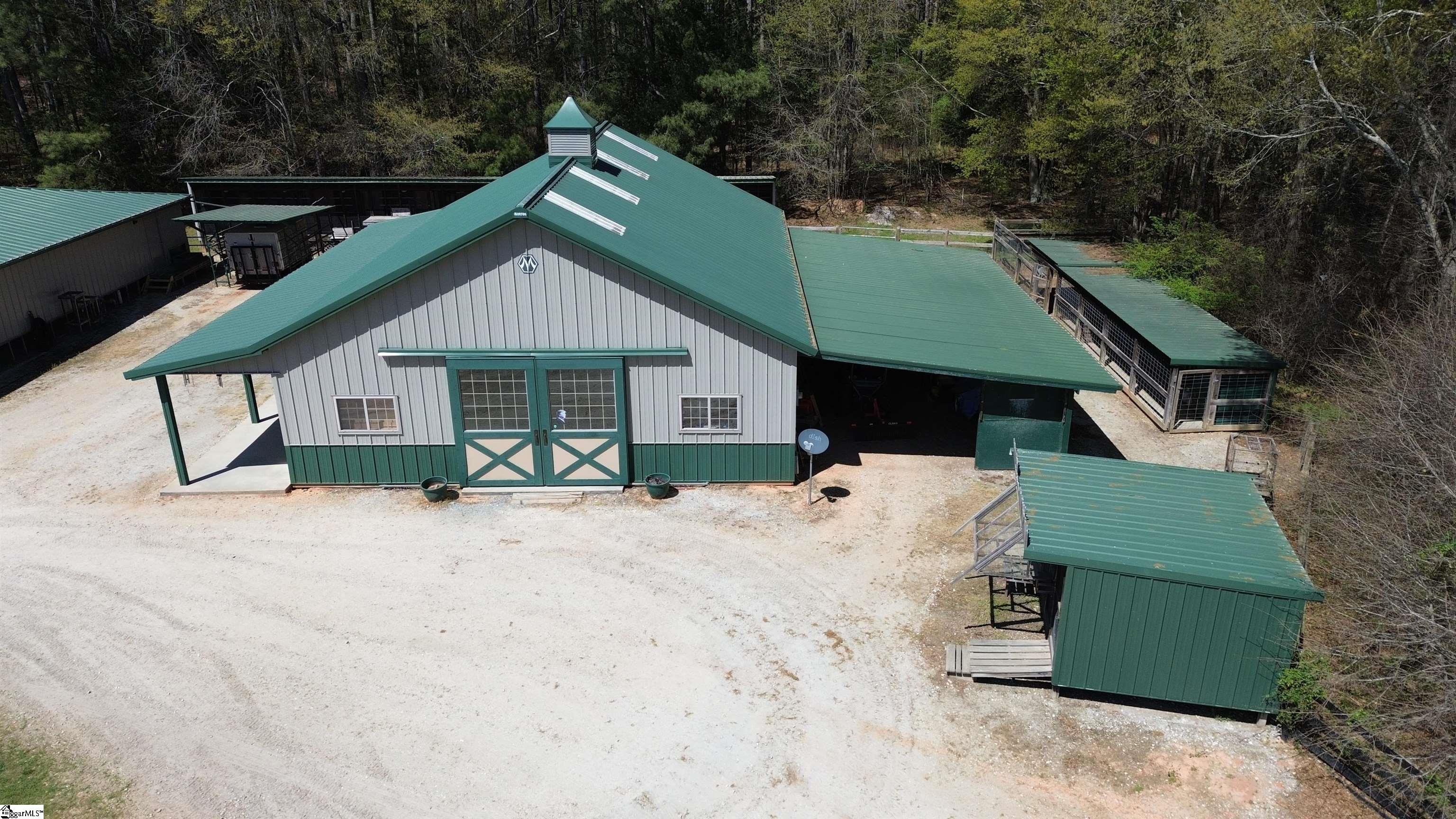 406 Casey Road Woodruff, SC 29388 - Photo 42 of 50 Barn has full workshop PLUS built in office, kitchen, bedroom, full bath and loft space.