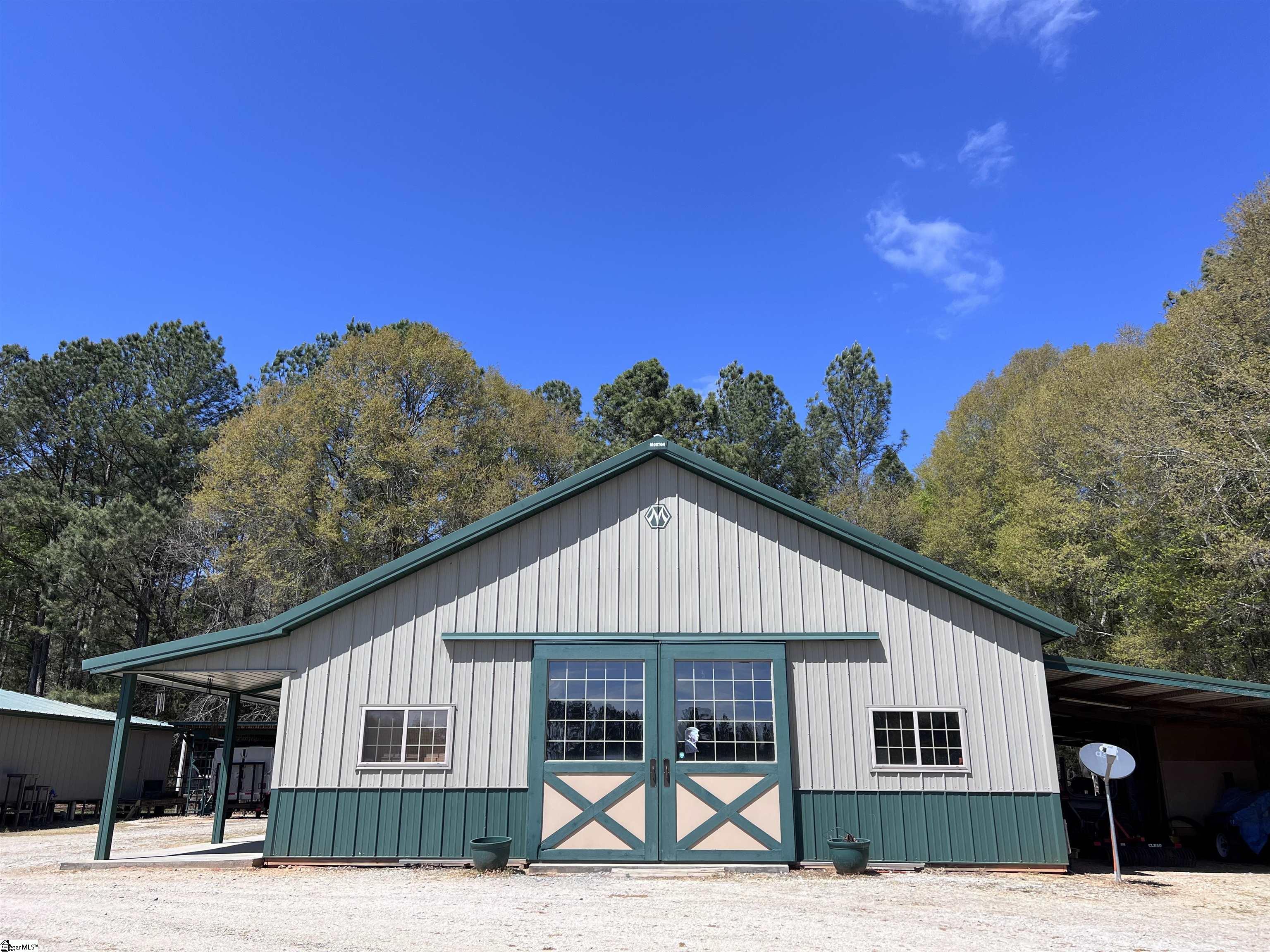406 Casey Road Woodruff, SC 29388 - Photo 44 of 50 Barn has full workshop PLUS built in office, kitchen, bedroom, full bath and loft space.