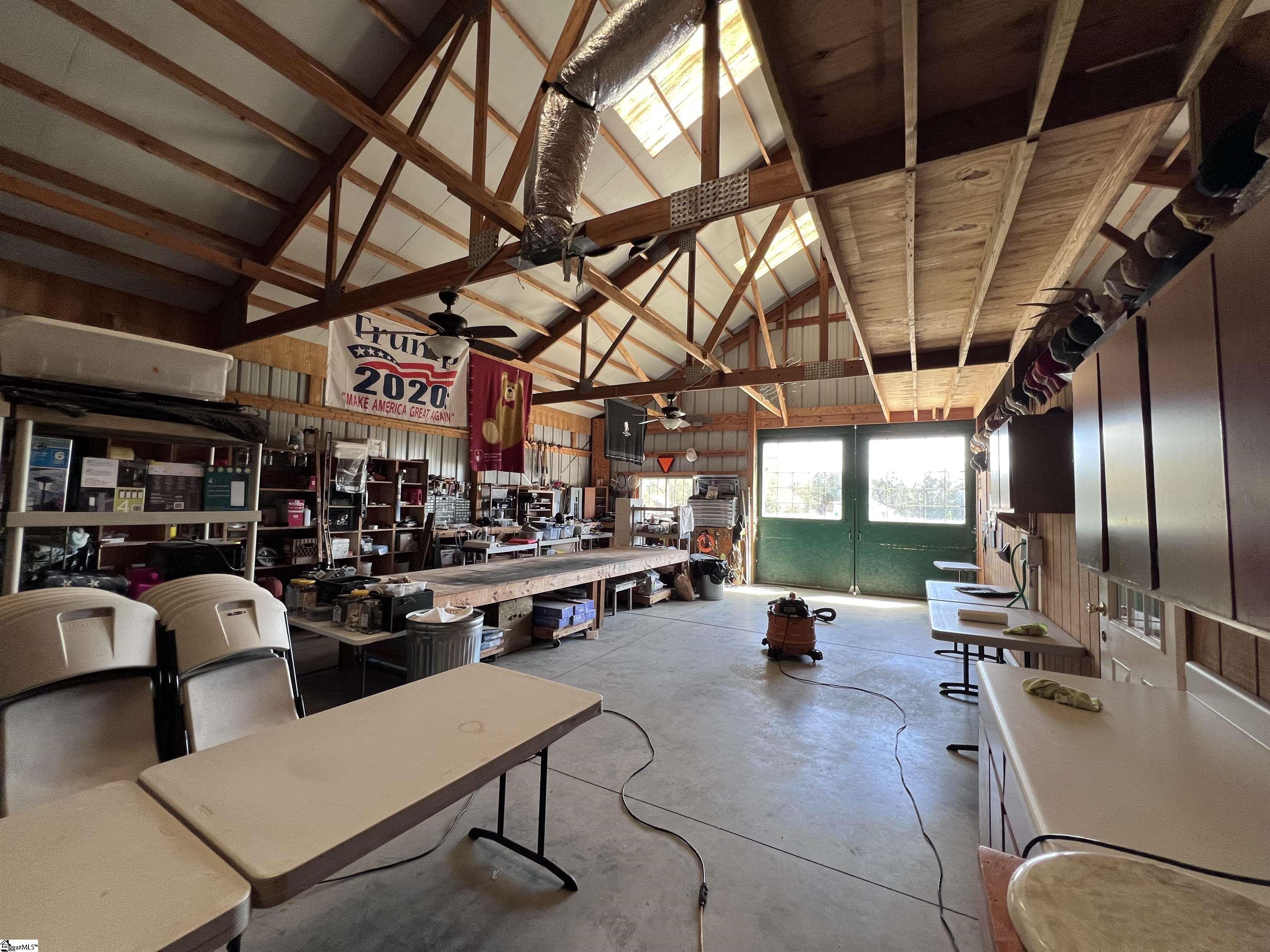 406 Casey Road Woodruff, SC 29388 - Photo 47 of 50 Barn has full workshop PLUS built in office, kitchen, bedroom, full bath and loft space.