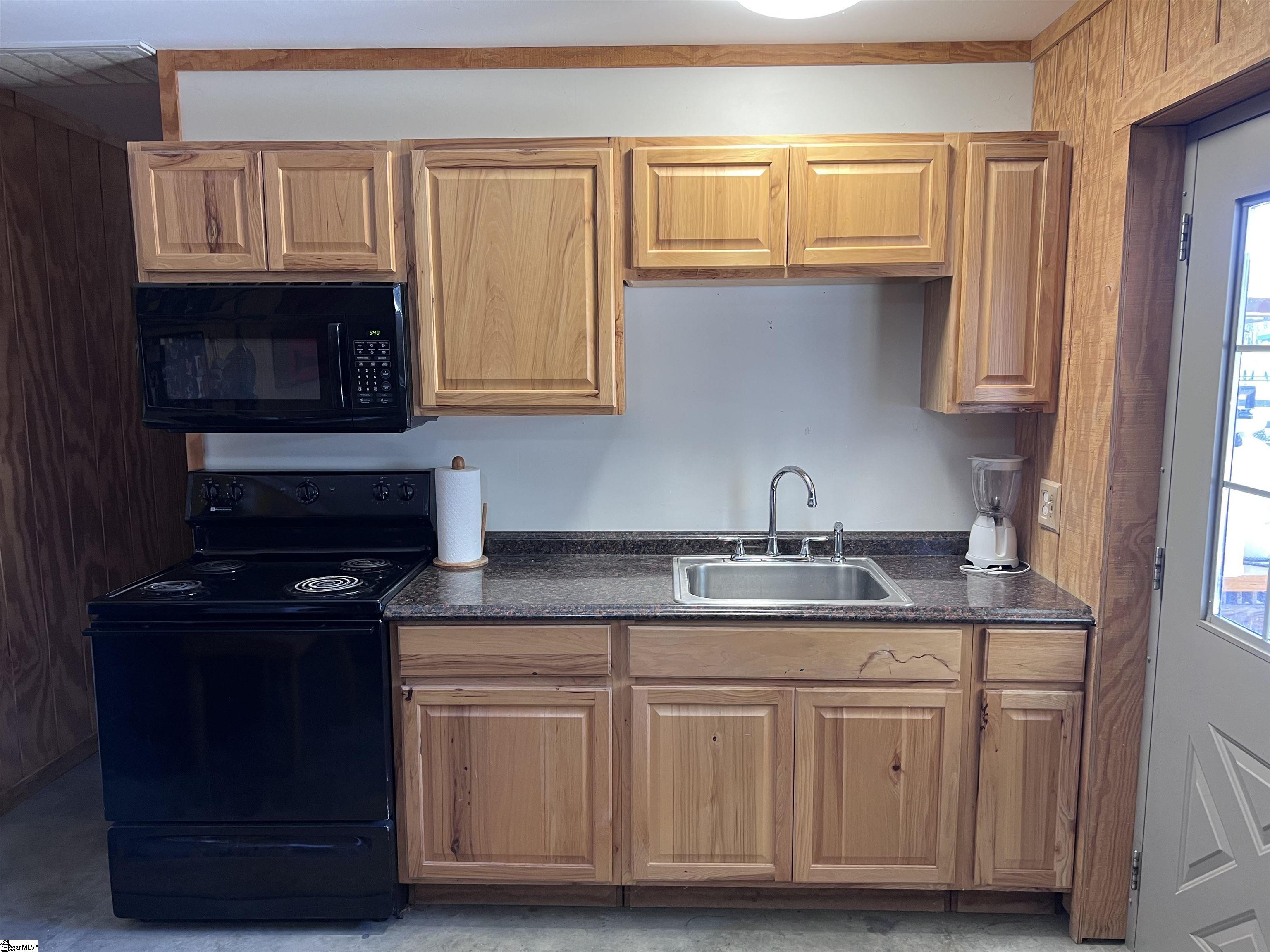 406 Casey Road Woodruff, SC 29388 - Photo 48 of 50 Barn has full workshop PLUS built in office, kitchen, bedroom, full bath and loft space.