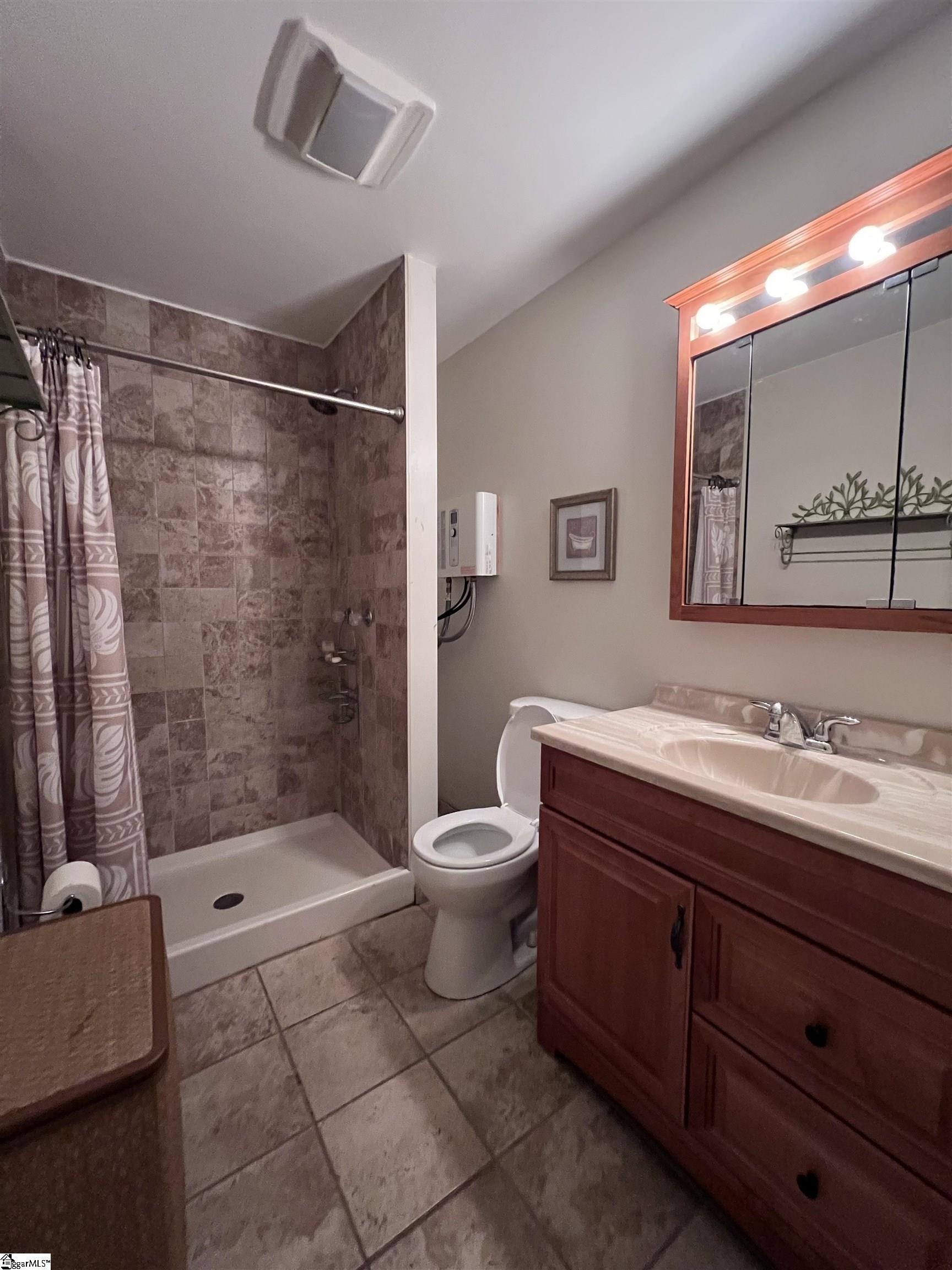 406 Casey Road Woodruff, SC 29388 - Photo 49 of 50 Barn has full workshop PLUS built in office, kitchen, bedroom, full bath and loft space.