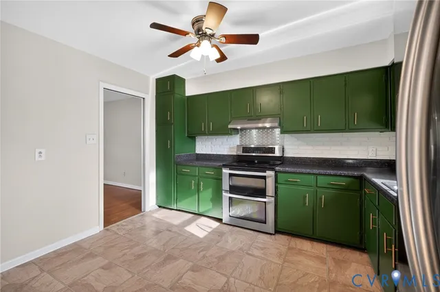 a kitchen with kitchen island a sink stainless steel appliances and cabinets