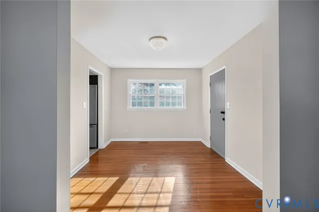 a view of an empty room and window