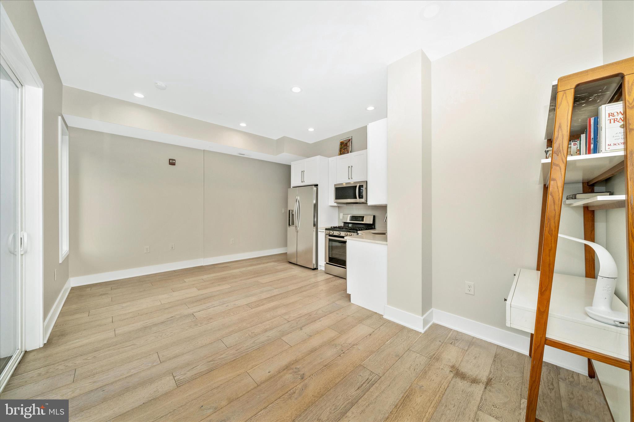 7129 Georgia Avenue Northwest, Unit 4 Washington, DC 20012 - Photo 13 of 30 a view of kitchen with wooden floor