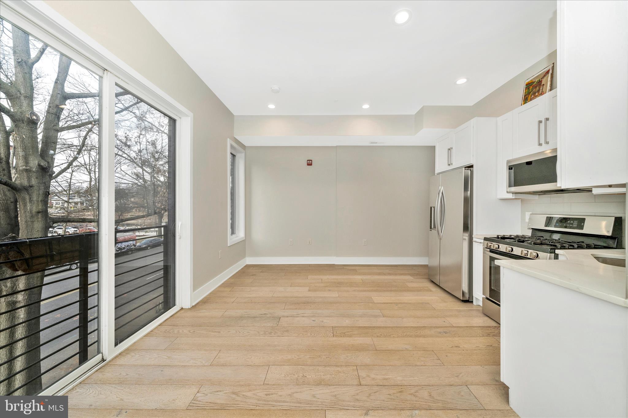 7129 Georgia Avenue Northwest, Unit 4 Washington, DC 20012 - Photo 14 of 30 a view of a kitchen with a stove top oven