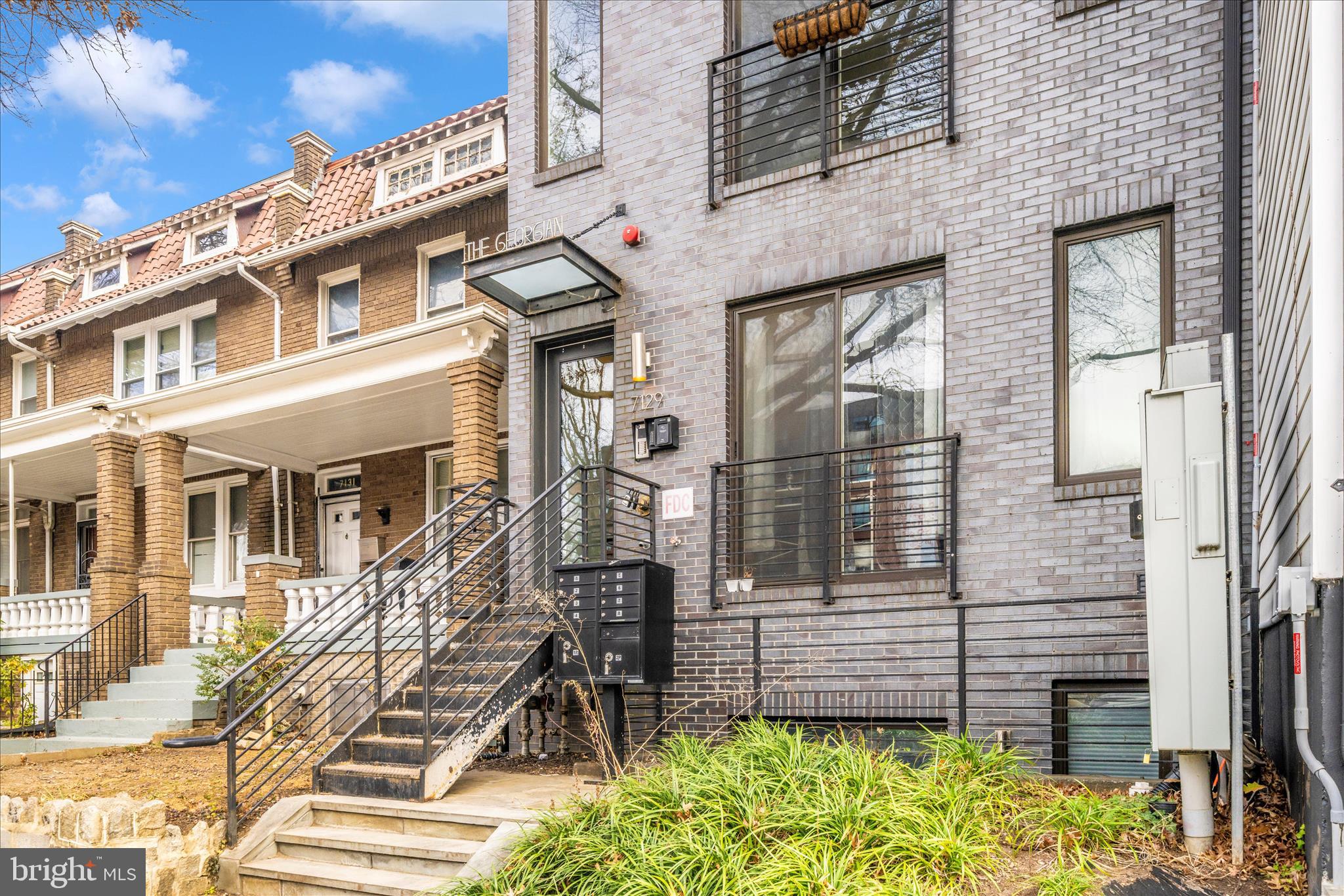 7129 Georgia Avenue Northwest, Unit 4 Washington, DC 20012 - Photo 4 of 30 a front view of a multi story residential apartment building